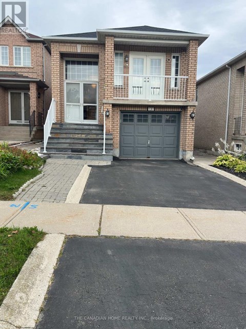 A house with a driveway in front of it.