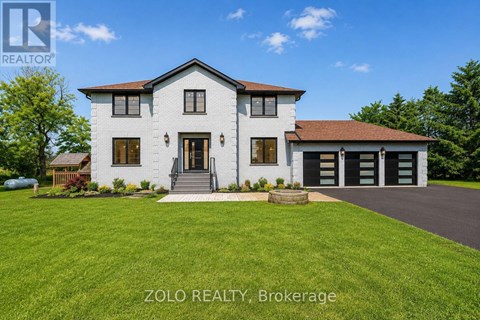A white house with a brown roof and a garage door is for sale by Zolo Realty Brokerage.