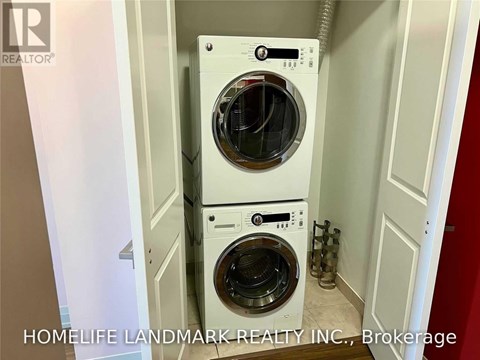 A washer and dryer in a small laundry room.