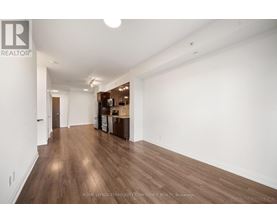 A room with wooden floors and white walls.