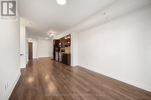 A room with wooden floors and white walls.