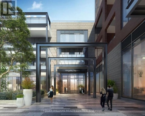 A modern building entrance with people walking in and out.