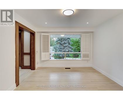 A room with a window and a door in it.