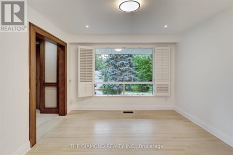 A room with a window and a door in it.