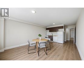 A dining room with a table and chairs is shown.