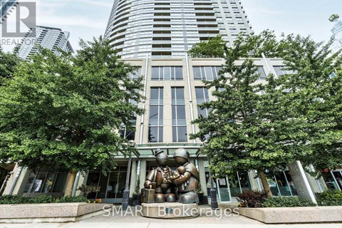A modern building with a sculpture in front of it.