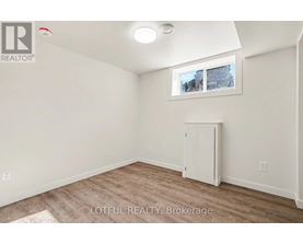 A room with a white cabinet and a window showing a snowy scene outside.
