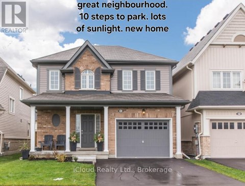A house with a brick facade and a grey garage door is for sale.