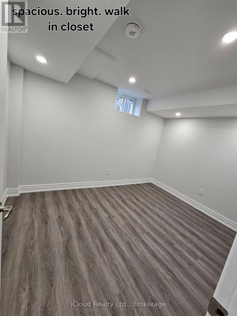 A spacious room with a bright walk in closet.