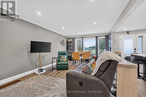 A living room with a grey couch and a flat screen TV.