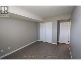 A room with a white door and a white closet door.