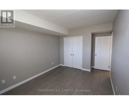 A room with a white door and a white closet door.