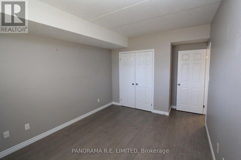 A room with a white door and a white closet door.