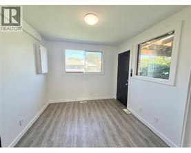 A room with a window and a door is shown.