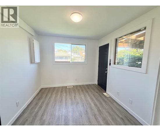 A room with a window and a door is shown.