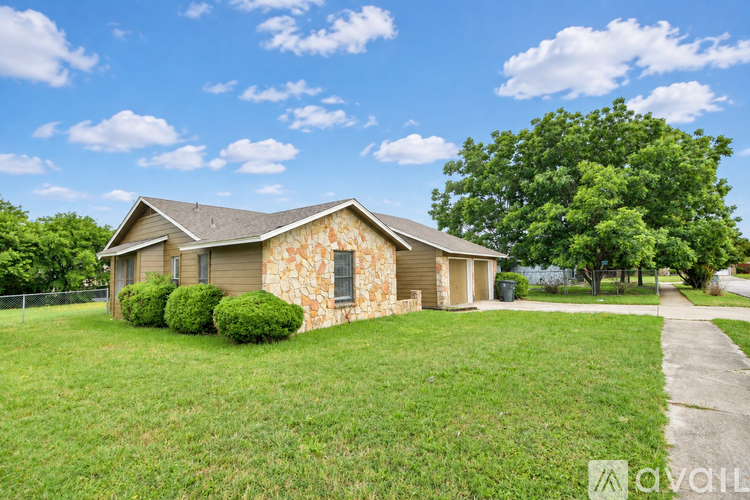 A house with a stone exterior is for sale.