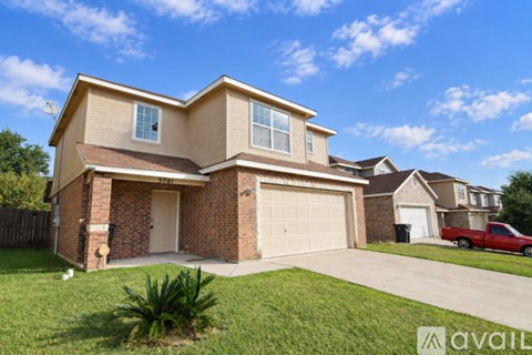 A two-story house with a garage is for sale.