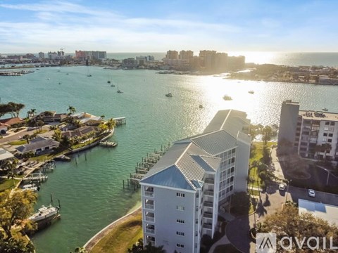 A view of a city with a body of water and buildings.