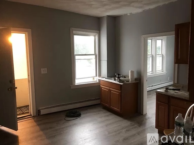 A kitchen with a sink and a window.