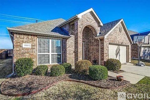 A house with a garage and a driveway in front.