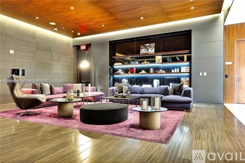 A modern living room with a variety of seating options and a large display of furniture in the background.