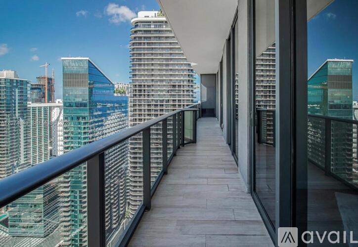 A balcony with a view of a city skyline.