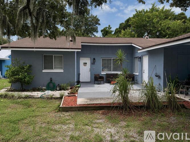A house with a blue front yard and a porch.