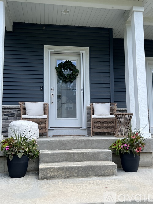 A house entrance with a wreath on the door.