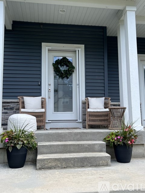 A house entrance with a wreath on the door.