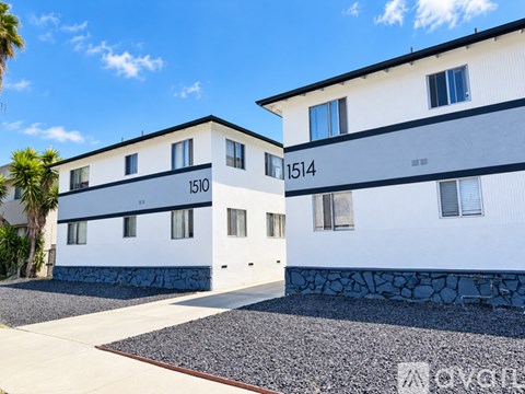 A white building with the numbers 1510 and 1514 on the side.