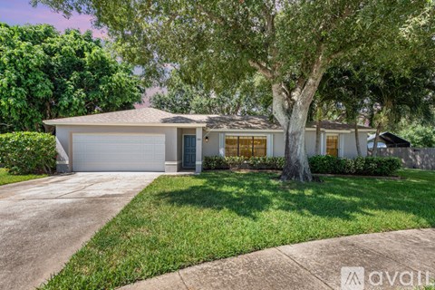 A house with a white garage door is for sale.