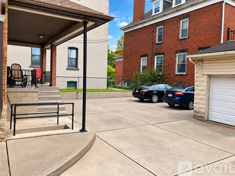 A building with a red brick exterior and a white garage door.