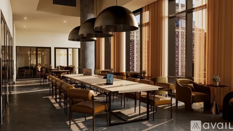 A modern dining room with a long table and chairs.