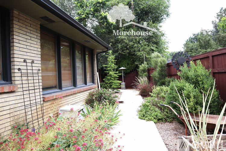 A garden with a sign that says "Morehouse" in the background.