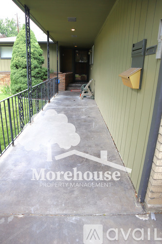 A Morehouse Property Management logo is on the concrete of a porch.
