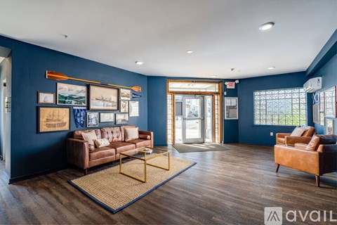 A living room with a brown couch and a yellow coffee table.