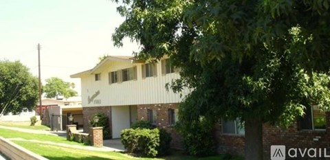 A house with a sign that says "available" in front of it.