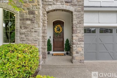 A house entrance with a wreath on the door.