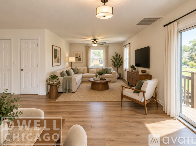 A well decorated living room with a white sofa set and a wooden chair.