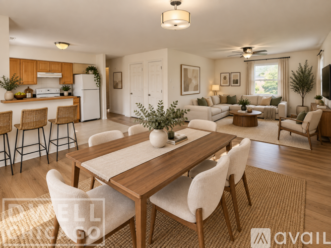 A well-lit, modern dining room with a wooden table and chairs.