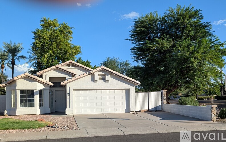 A house with a white garage door is for sale.