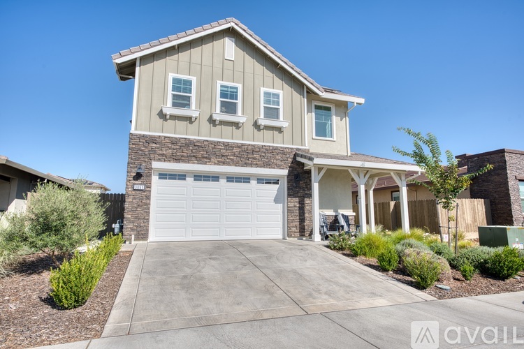 A house with a garage is available for sale.