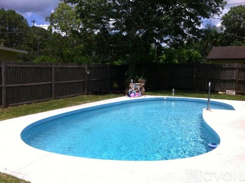 A small kid pool with a slide.