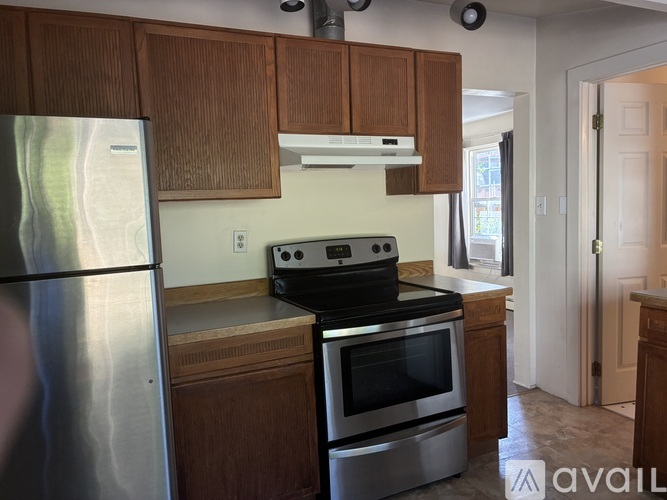 A kitchen with a stove and oven built into the counter.