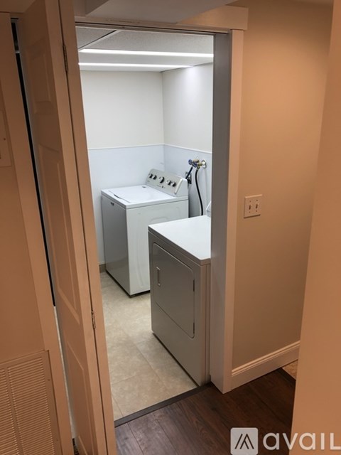 A bathroom with a sink and mirror.