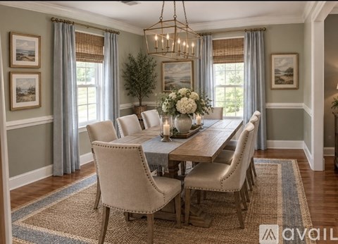 A dining room with a table set for six and a chandelier hanging from the ceiling.