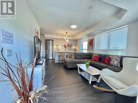 A living room with a white couch and a coffee table.
