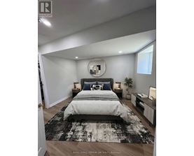 A bedroom with a large bed and a mirror on the wall.
