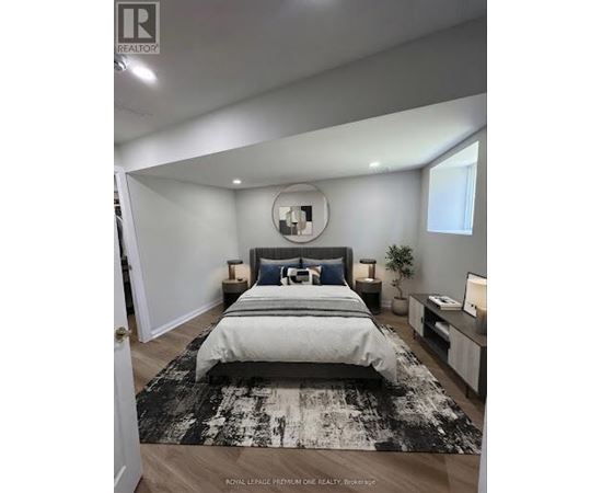 A bedroom with a large bed and a mirror on the wall.
