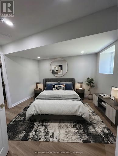 A bedroom with a large bed and a mirror on the wall.